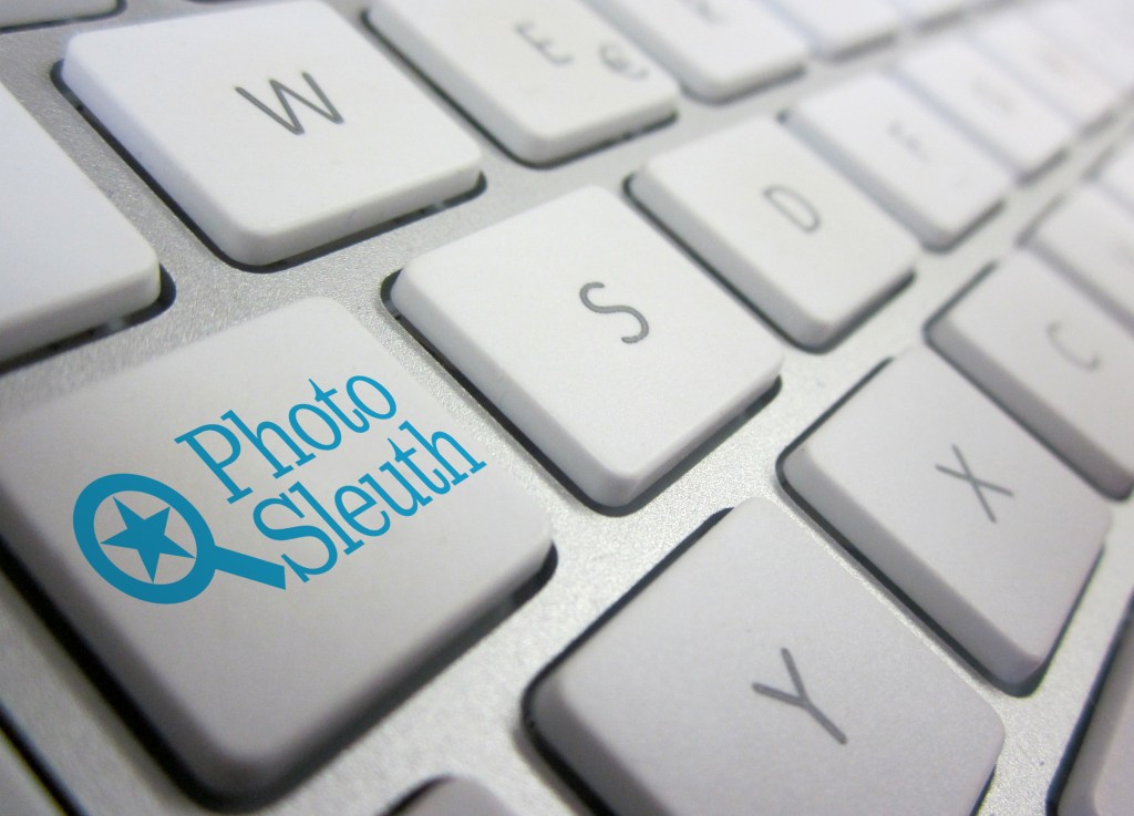 keyboard with PhotoSleuth.org logo on one key